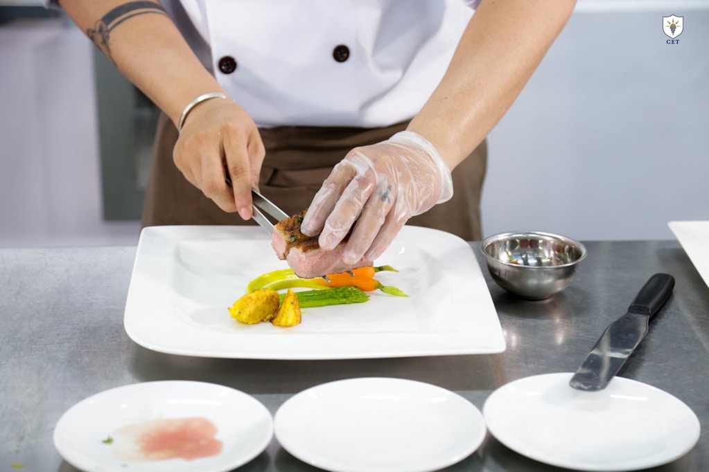 Chef plating a dish in a professional kitchen