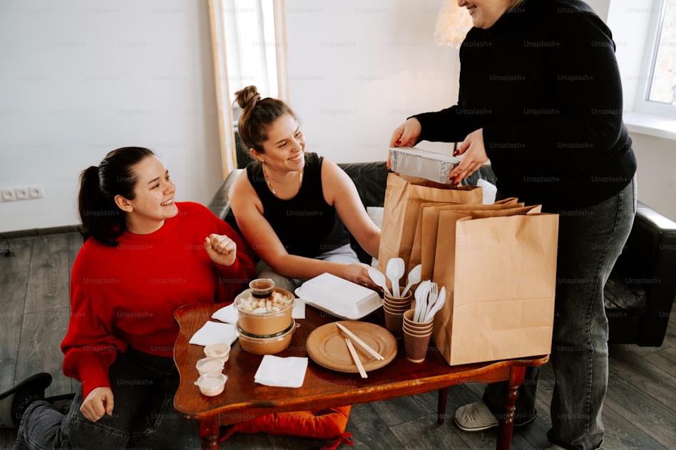 Guests receiving delivery bags at a table